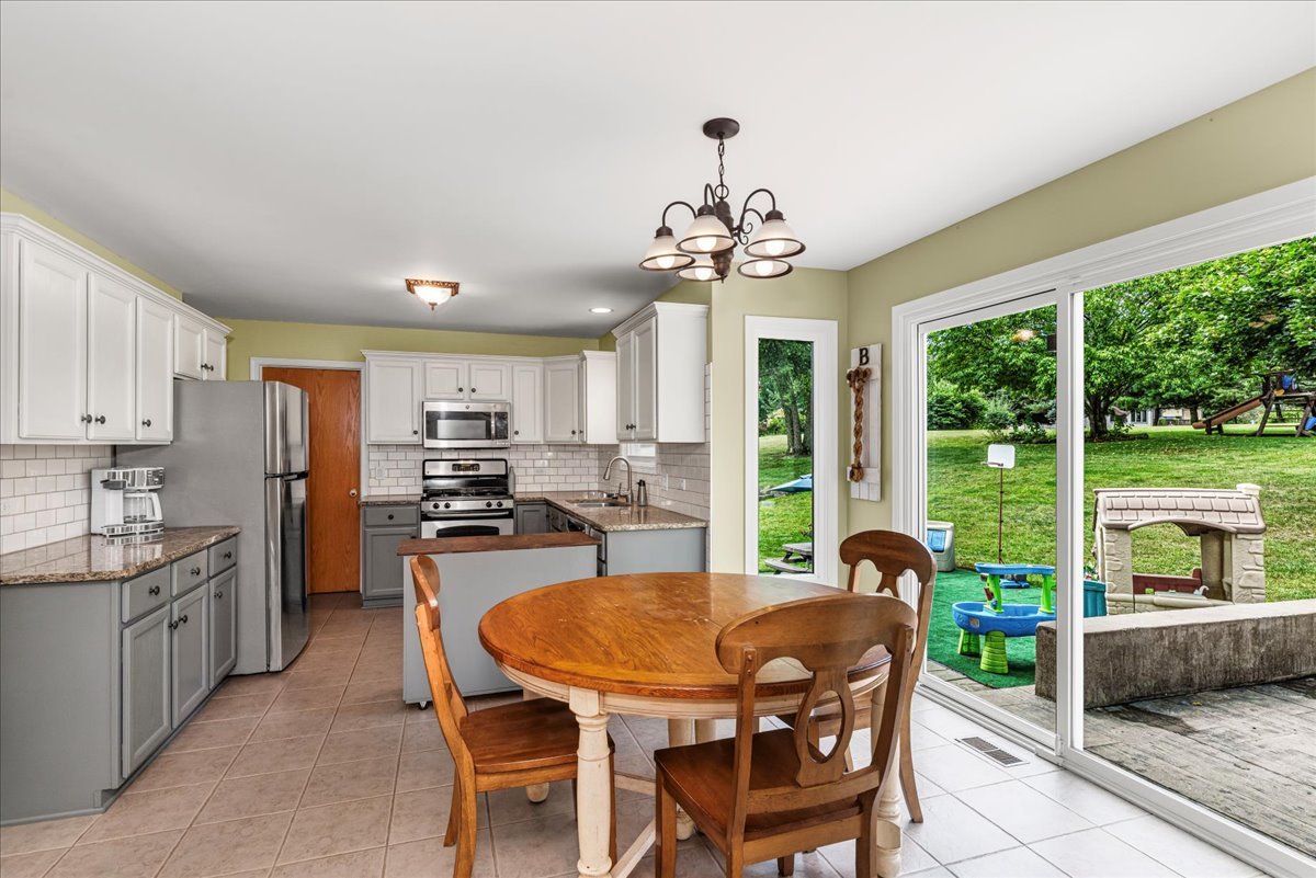 11111 Huron Drive Spring Grove, IL 60081 - Photo 6 of 20 a view of a dining room with furniture window and outside view
