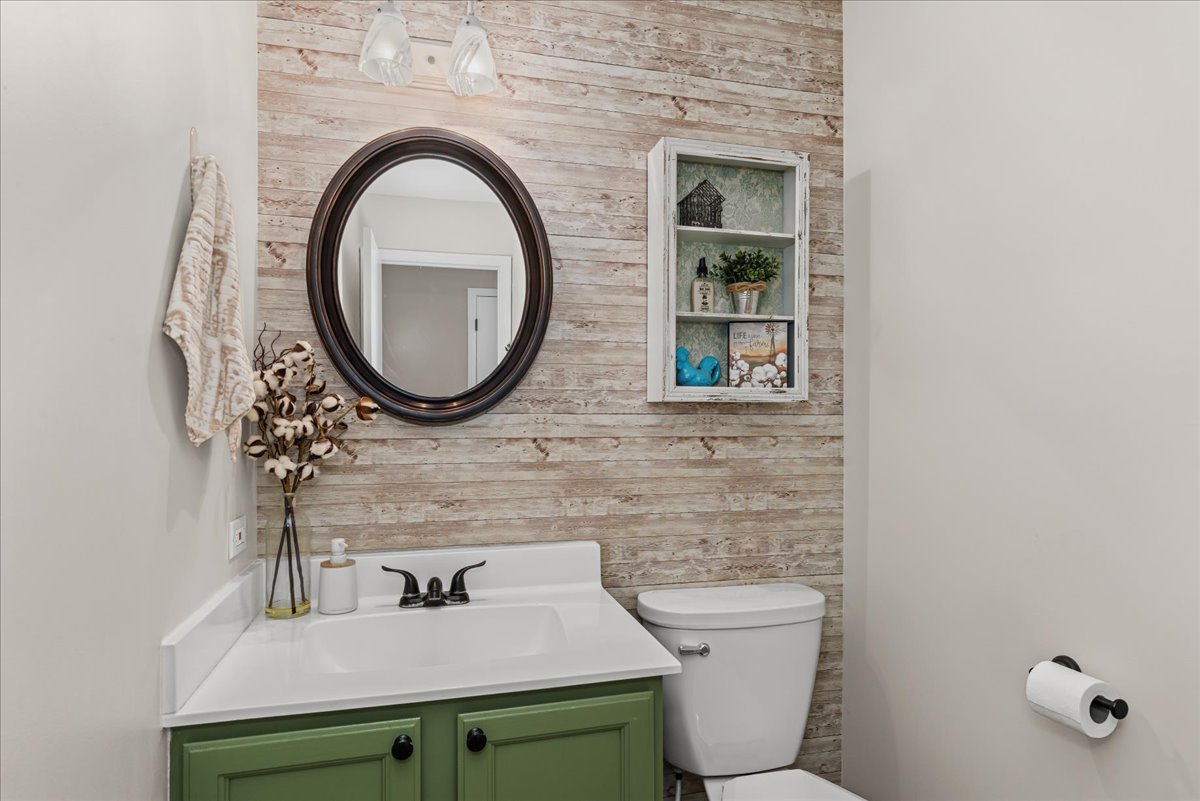 11111 Huron Drive Spring Grove, IL 60081 - Photo 8 of 20 a bathroom with a toilet sink and mirror