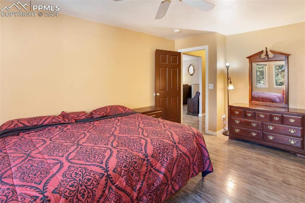833 Spring Valley Drive Divide, CO 80814 - Photo 23 of 50 a bedroom with a bed and a dresser