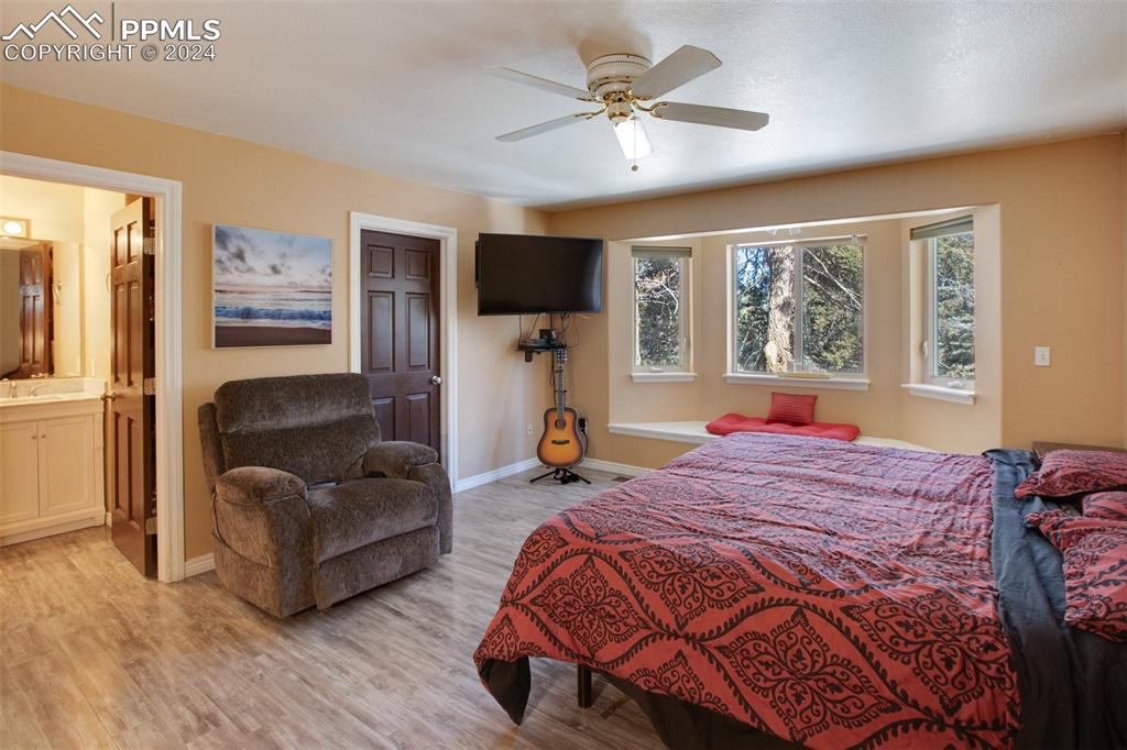 833 Spring Valley Drive Divide, CO 80814 - Photo 24 of 50 a bedroom with furniture and a window