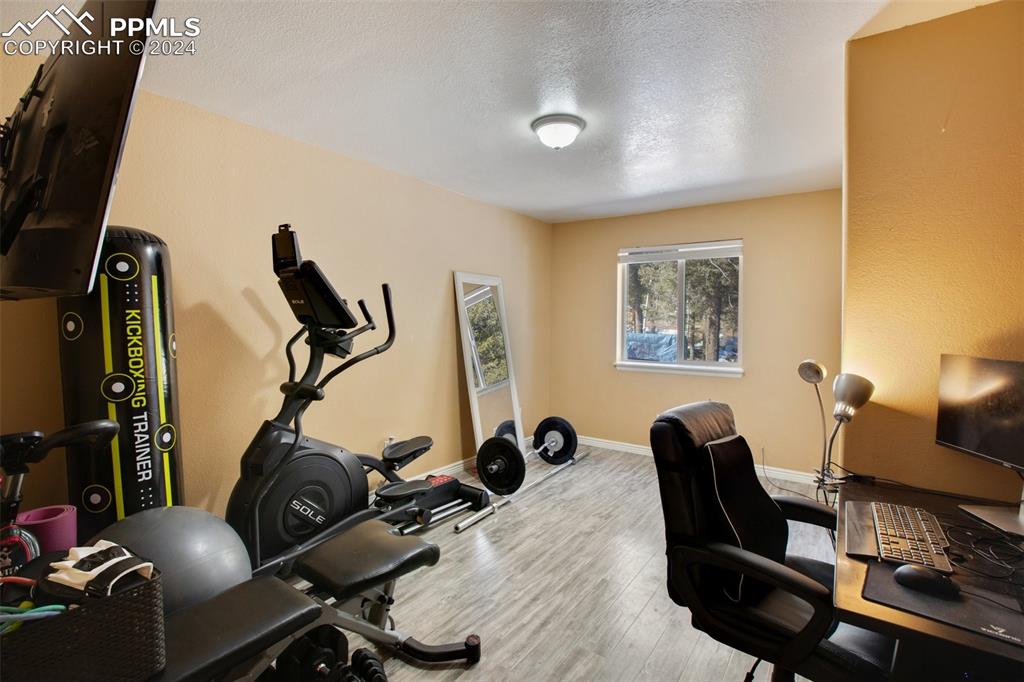 833 Spring Valley Drive Divide, CO 80814 - Photo 33 of 50 a view of a workspace with furniture and a window
