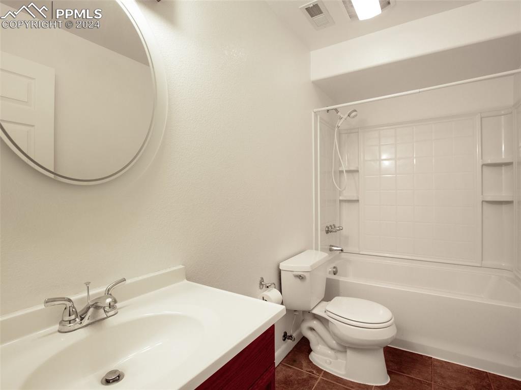 833 Spring Valley Drive Divide, CO 80814 - Photo 37 of 50 a bathroom with a sink toilet and shower