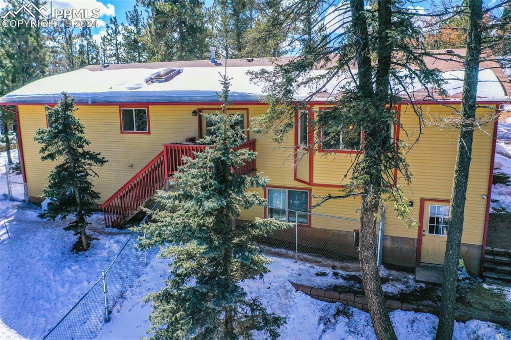 833 Spring Valley Drive Divide, CO 80814 - Photo 5 of 50 a front view of a house with garden