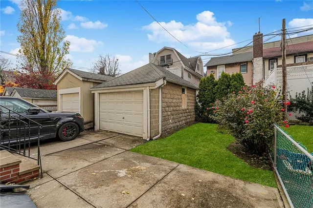 a view of a car parked in front of a house