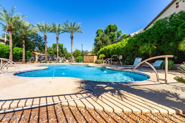 a view of a swimming pool with a patio