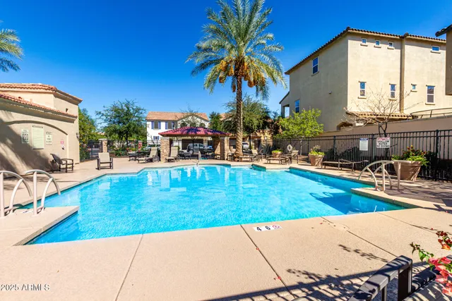 a view of a swimming pool with a lounge chairs