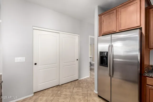 a view of a kitchen with a refrigerator