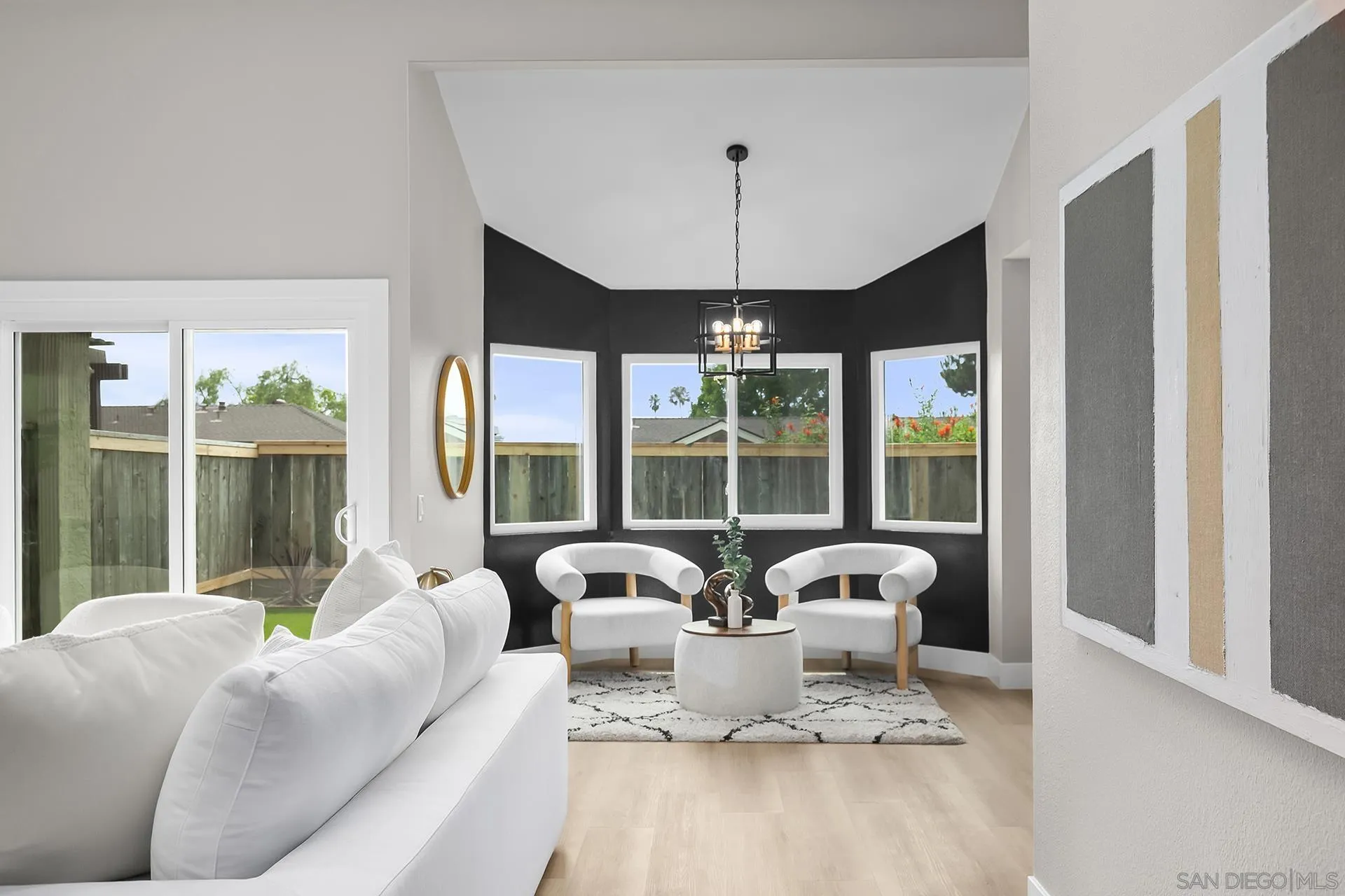 3226 Old Heather Road San Diego, CA 92111 - Photo 12 of 45 a living room with furniture and a large window