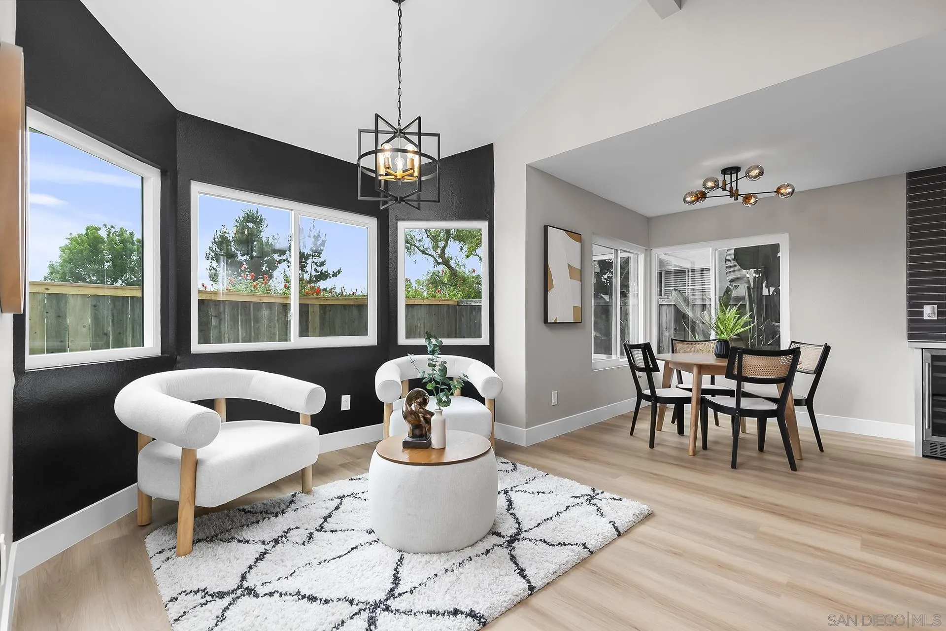 3226 Old Heather Road San Diego, CA 92111 - Photo 14 of 45 a dining room with furniture a chandelier and wooden floor