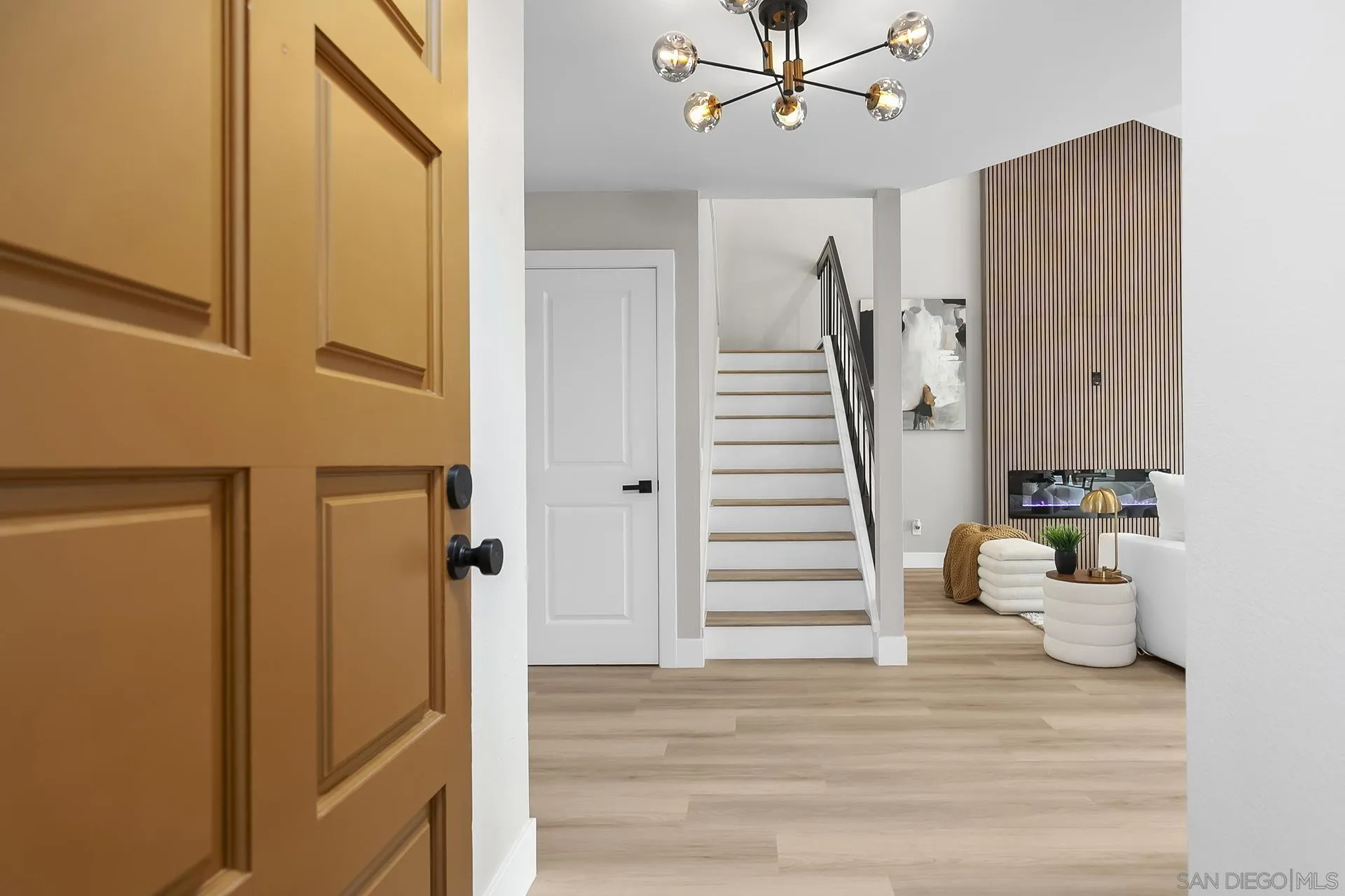 3226 Old Heather Road San Diego, CA 92111 - Photo 2 of 45 a view of a hallway with wooden floor and entryway
