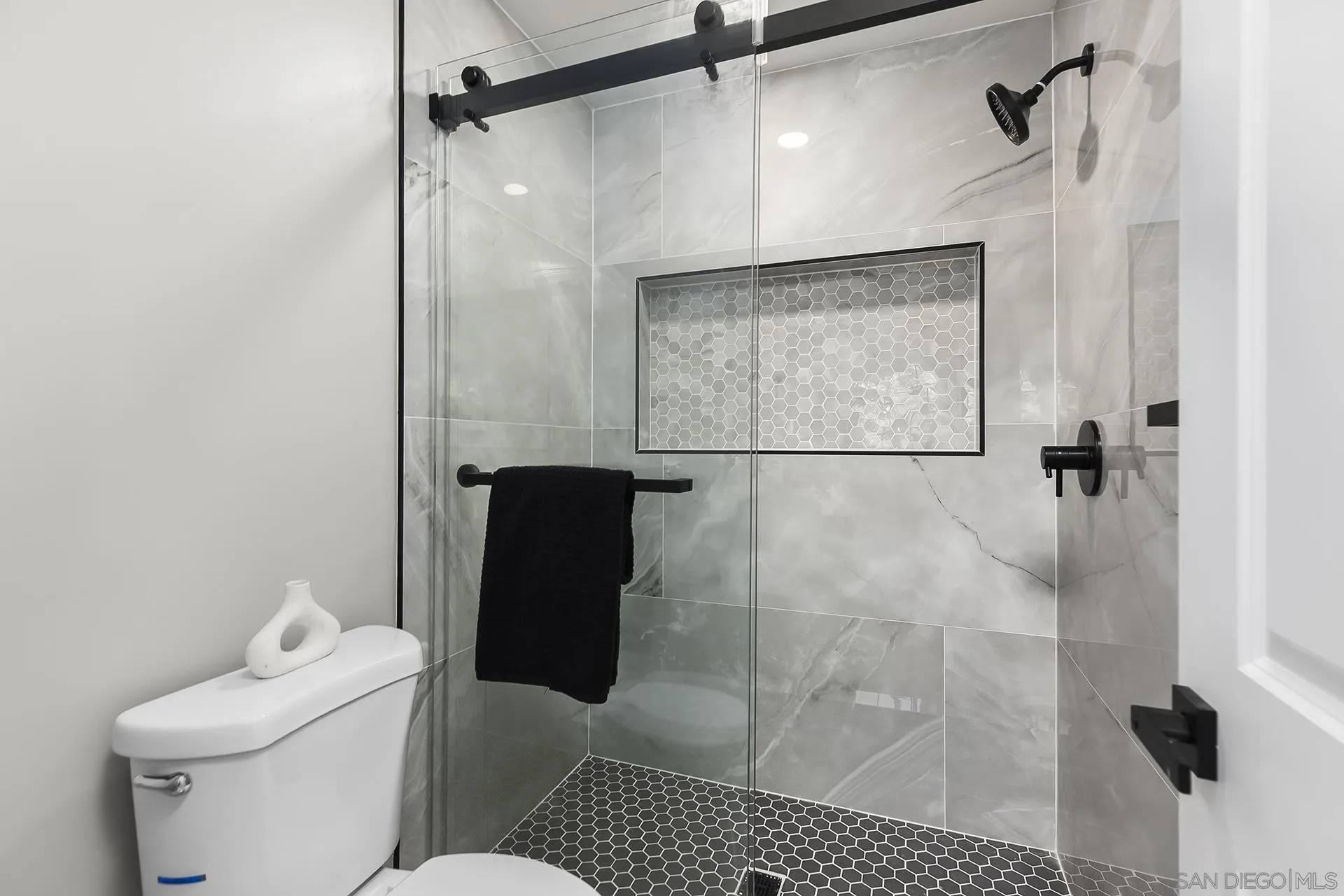 3226 Old Heather Road San Diego, CA 92111 - Photo 32 of 45 a bathroom with a toilet and a shower