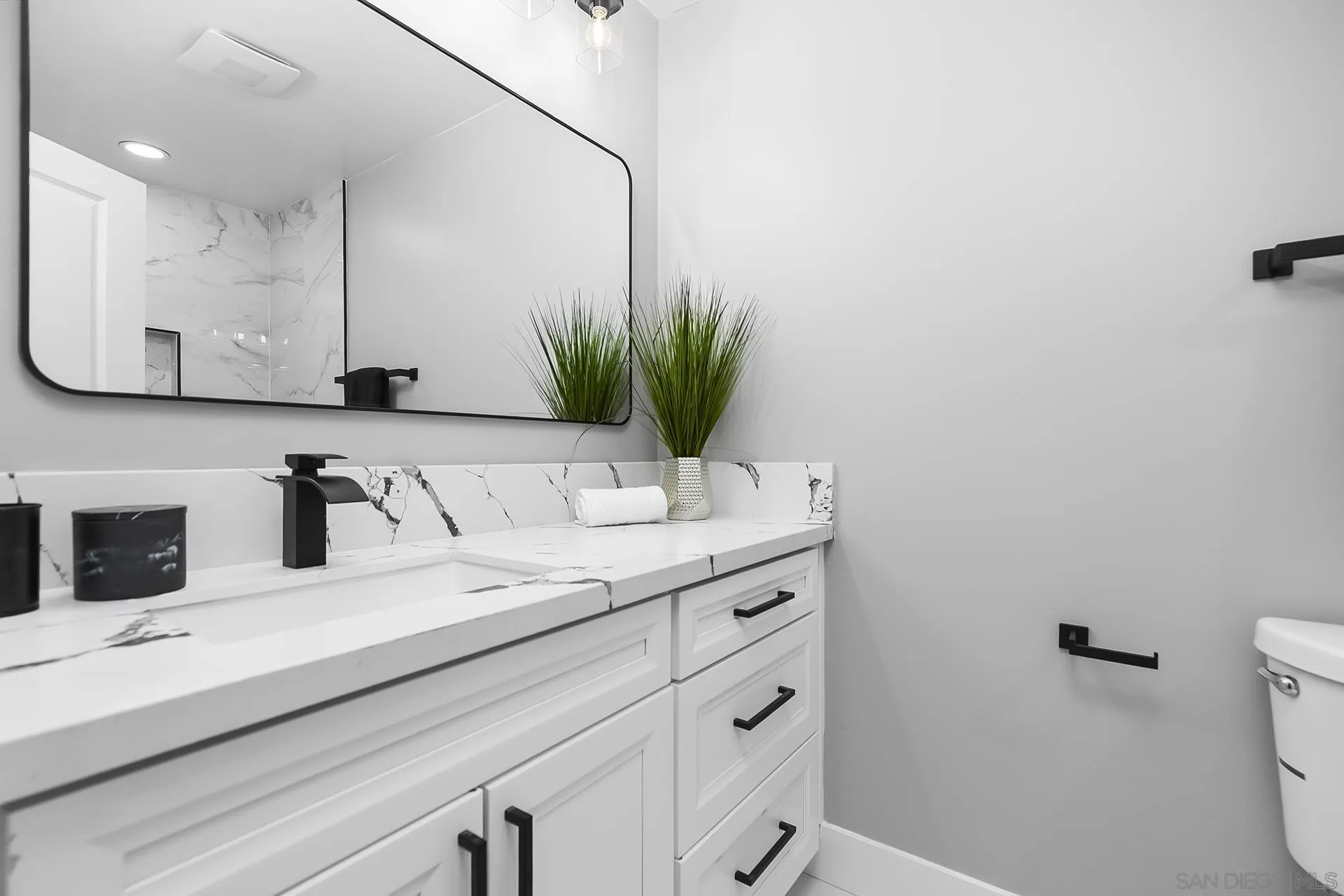 3226 Old Heather Road San Diego, CA 92111 - Photo 37 of 45 a bathroom with a sink and a mirror