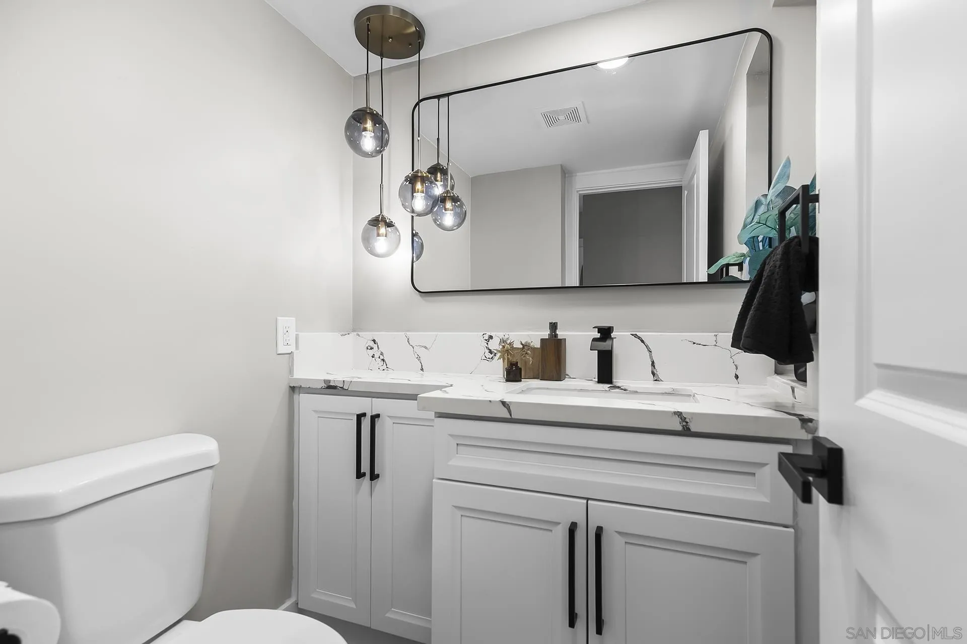 3226 Old Heather Road San Diego, CA 92111 - Photo 39 of 45 a bathroom with a sink vanity and toilet