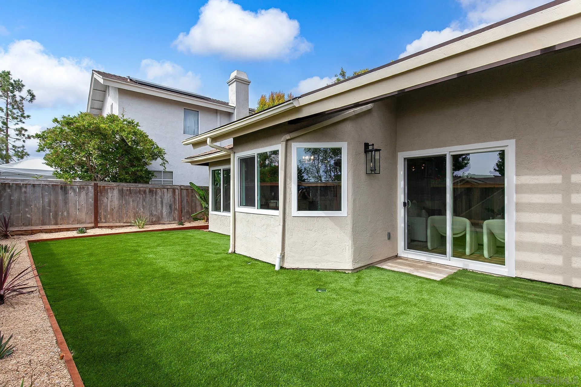 3226 Old Heather Road San Diego, CA 92111 - Photo 42 of 45 a view of an house with backyard space and a tub