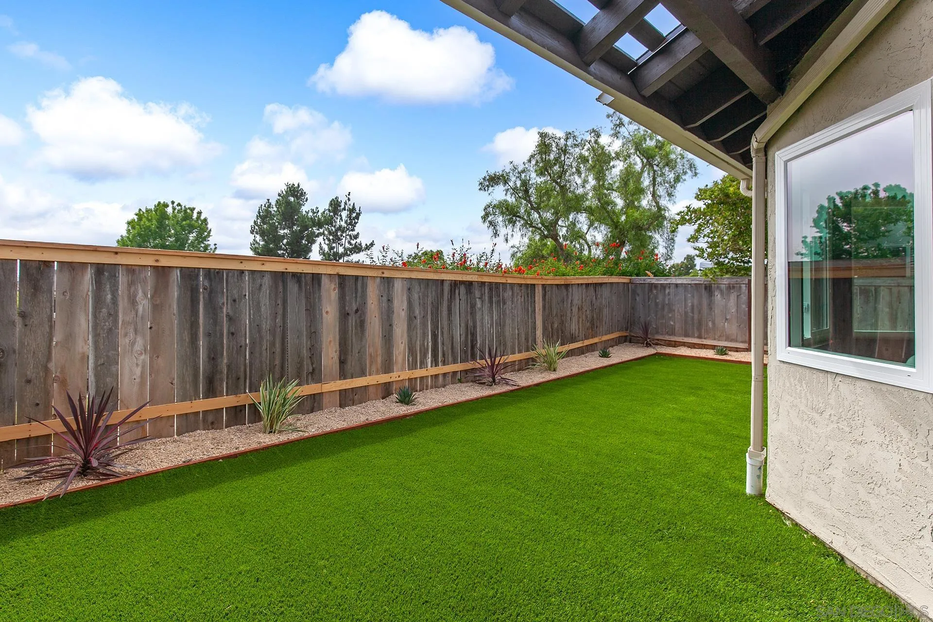 3226 Old Heather Road San Diego, CA 92111 - Photo 44 of 45 a view of a backyard with a garden