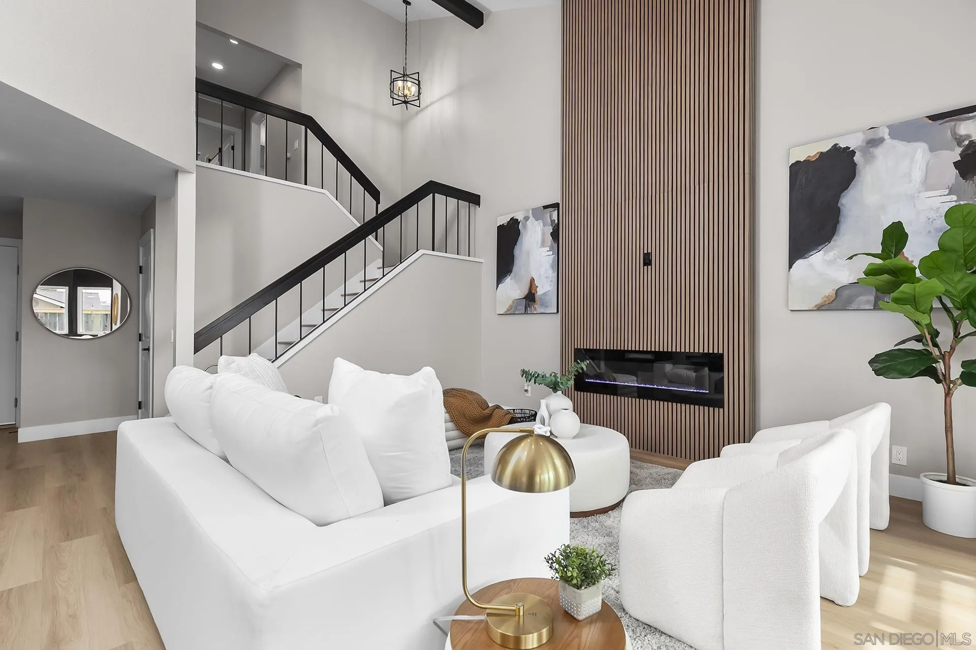 3226 Old Heather Road San Diego, CA 92111 - Photo 7 of 45 a living room with furniture flowers and wooden floor