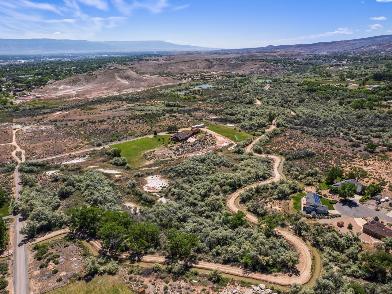 2085 East 1/2 Road Grand Junction, CO 81507 - Photo 8 of 10 an aerial view of residential houses with outdoor space