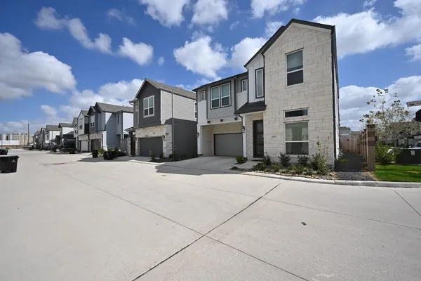 a front view of a house with yard
