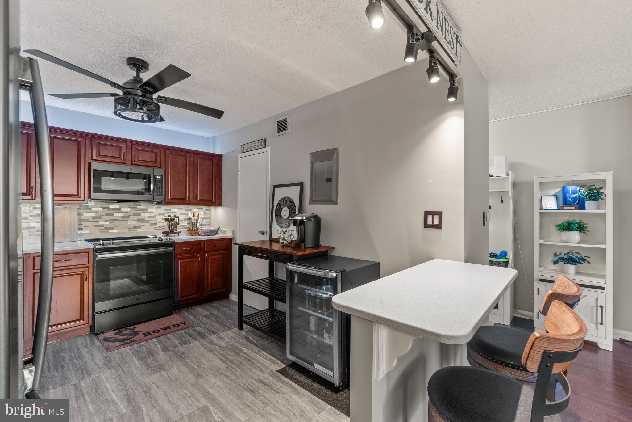 205 East Joppa Road, Unit 708 Baltimore, MD 21286 - Photo 15 of 35 custom track lighting provides ample light