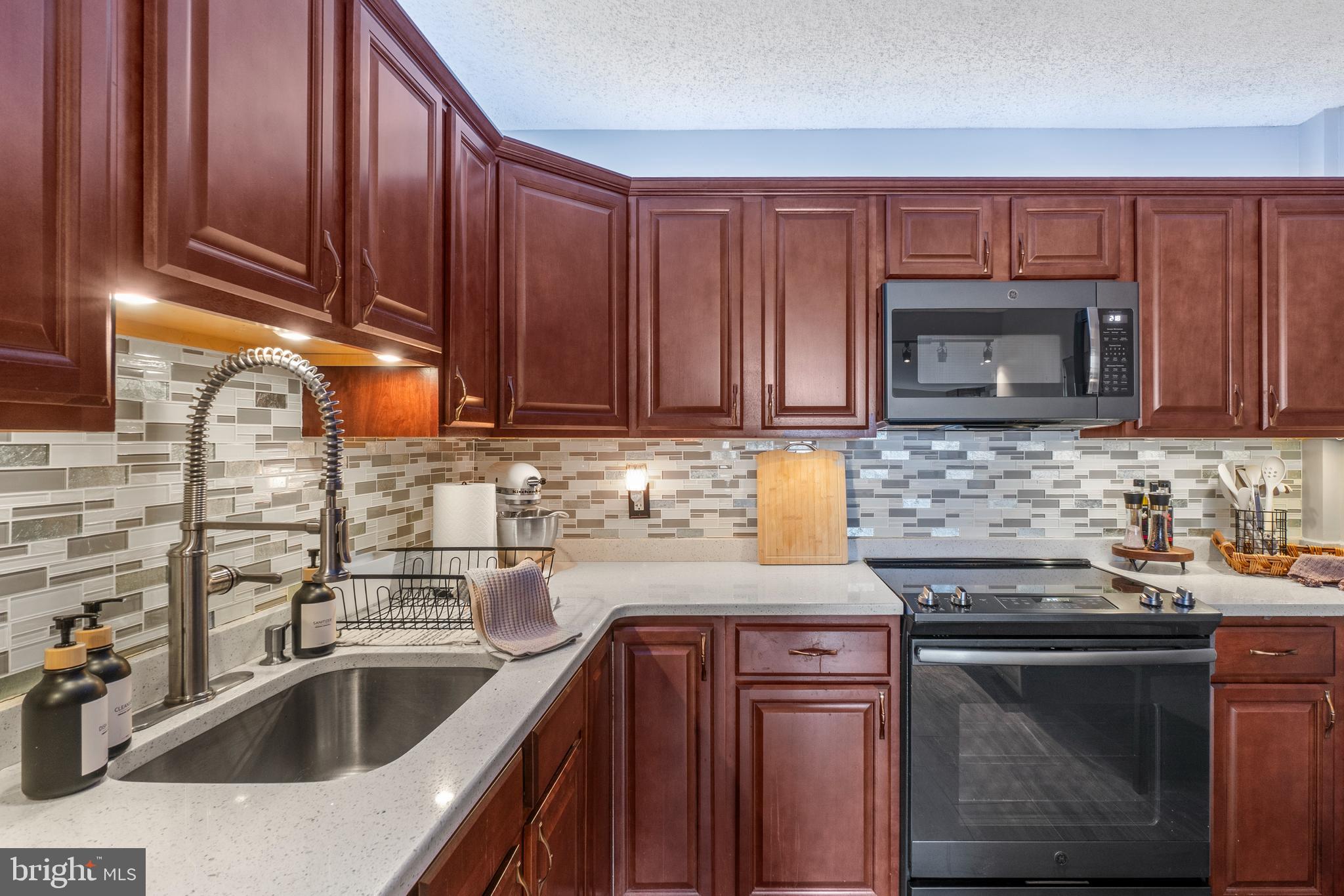205 East Joppa Road, Unit 708 Baltimore, MD 21286 - Photo 17 of 35 beautiful tile backsplash with ambiant lighting