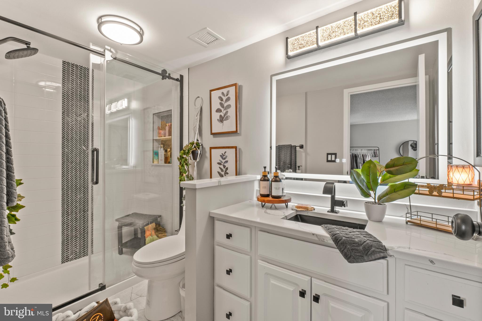 205 East Joppa Road, Unit 708 Baltimore, MD 21286 - Photo 23 of 35 smart mirror installed in hall bath . New vanity