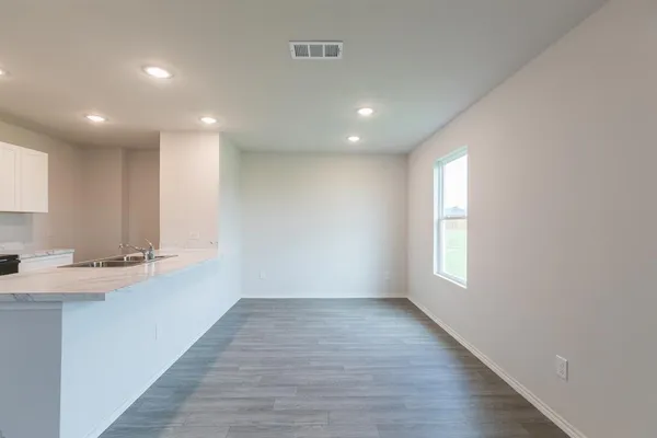 a view of a kitchen with a sink and a window