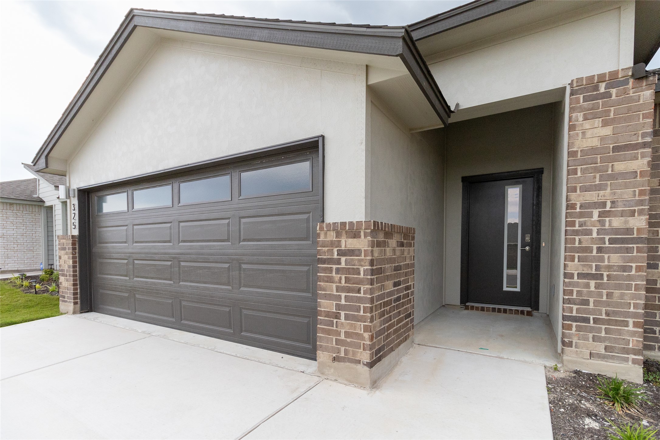 325 Coda Crossing Georgetown, TX 78633 - Photo 1 of 24 a view of outdoor space and garage