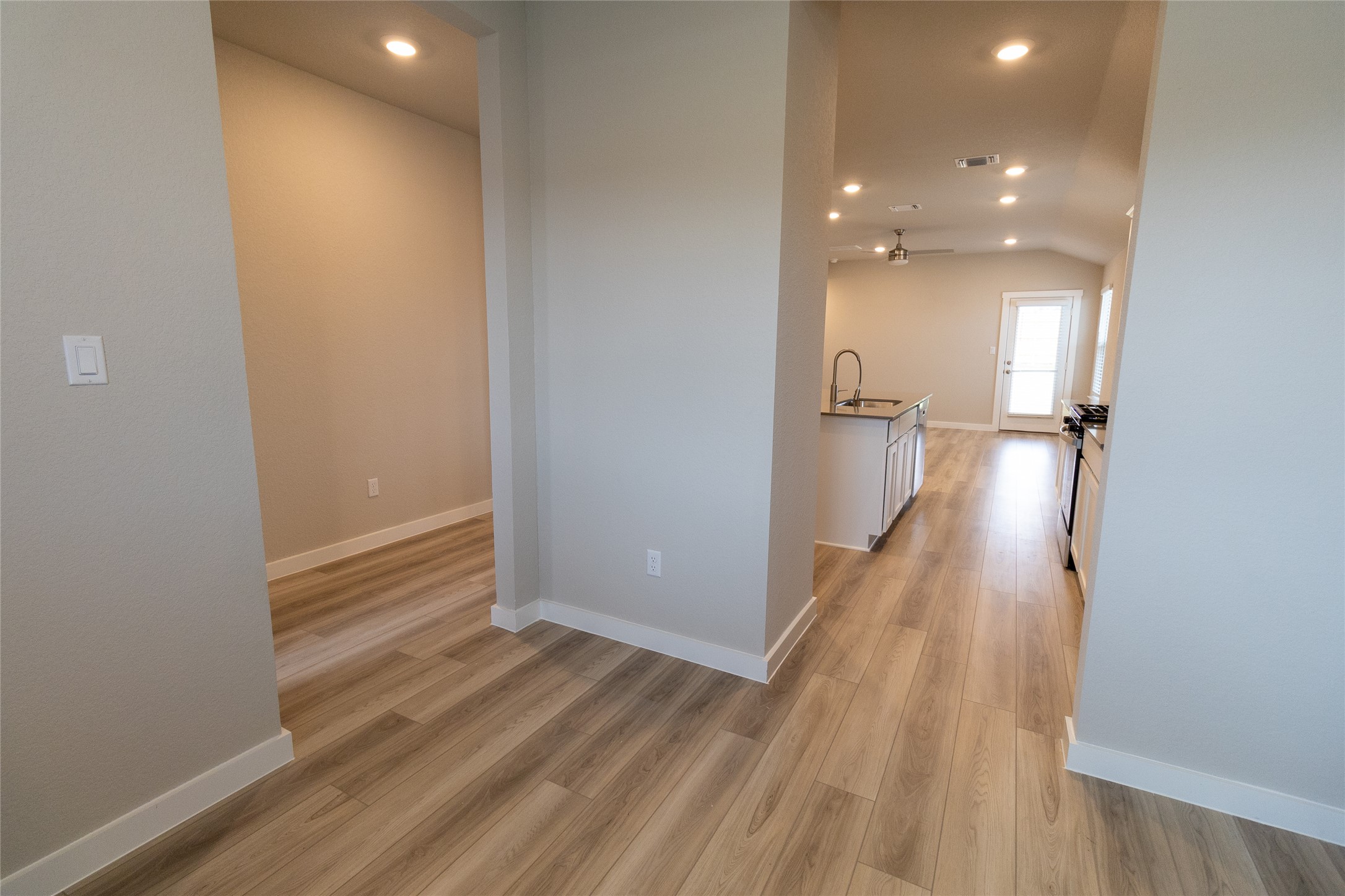 325 Coda Crossing Georgetown, TX 78633 - Photo 4 of 24 a view of a hallway with wooden floor