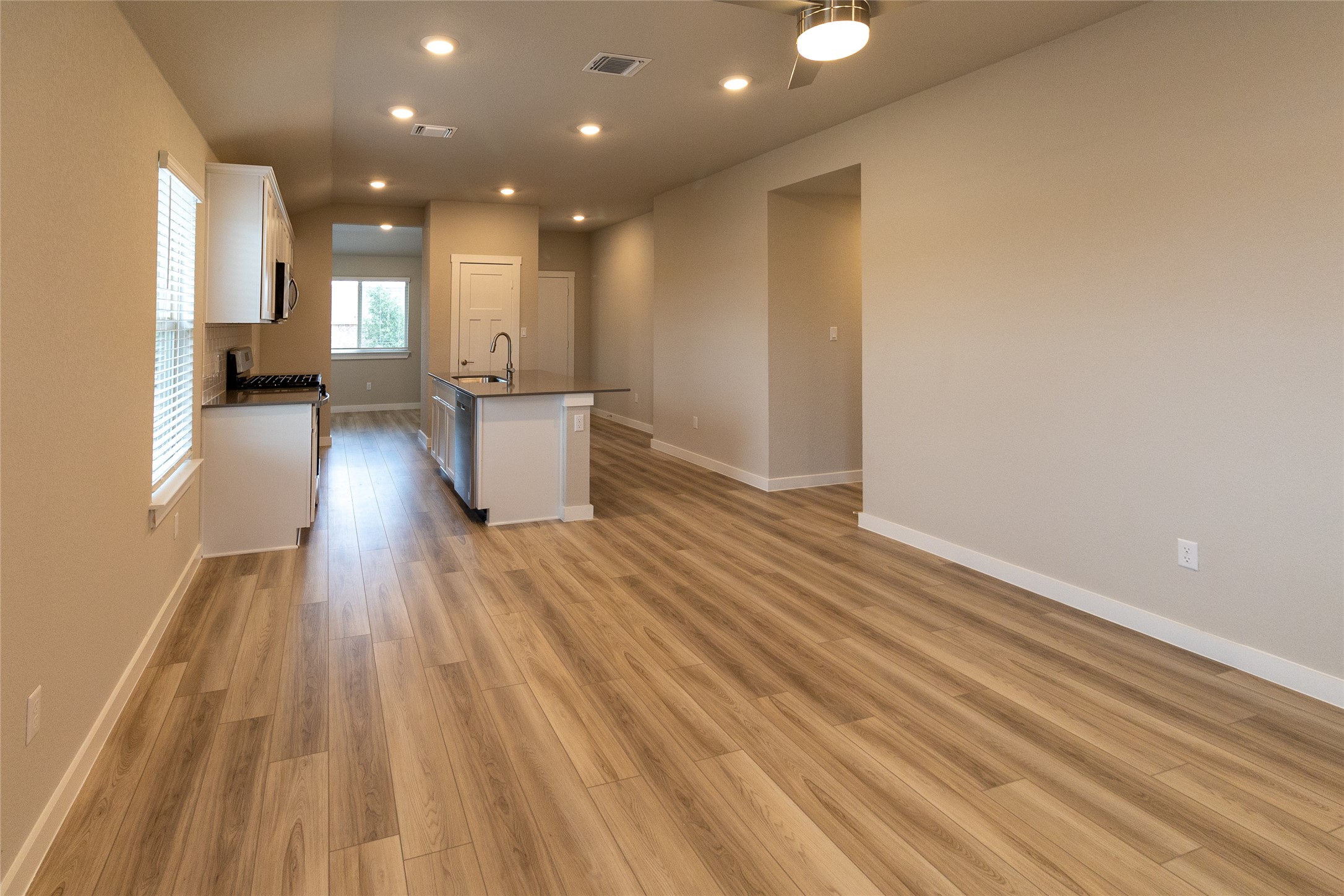 325 Coda Crossing Georgetown, TX 78633 - Photo 5 of 24 a view of a living room with wooden floor and a window