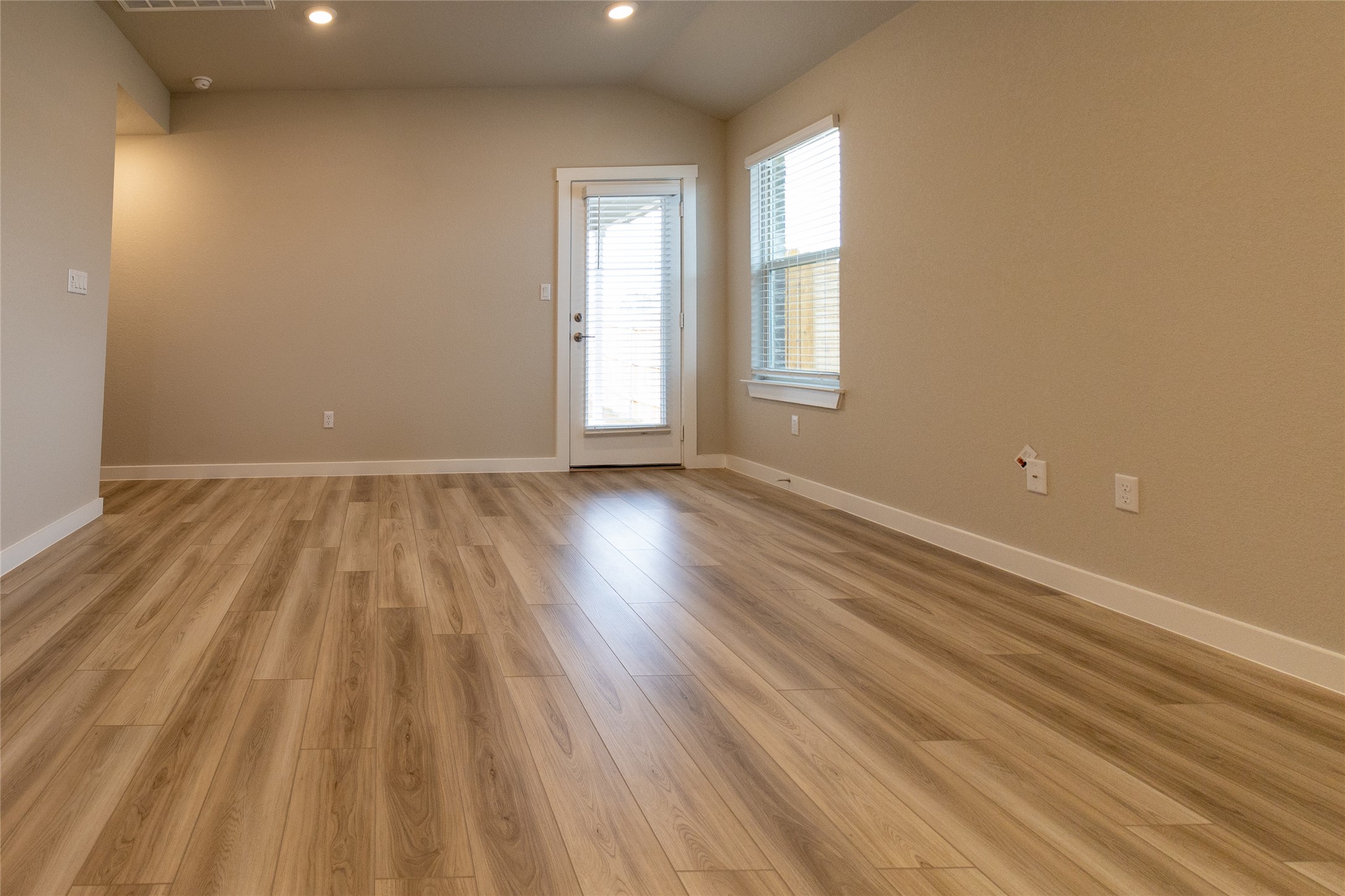 325 Coda Crossing Georgetown, TX 78633 - Photo 10 of 24 an empty room with wooden floor and windows