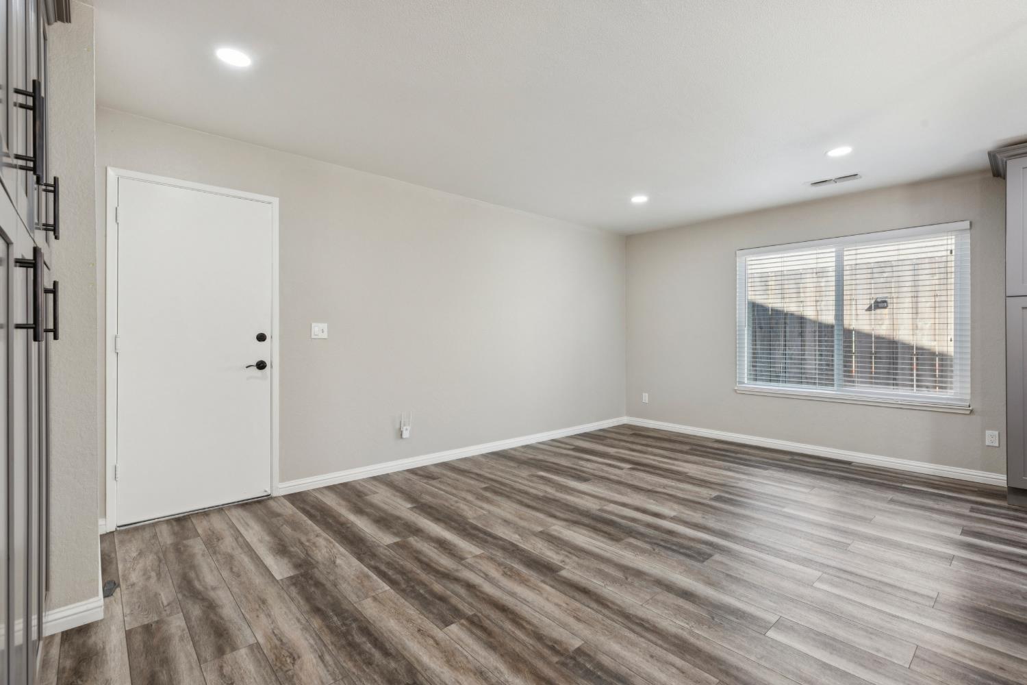 2612 Star Oak Court Modesto, CA 95355 - Photo 18 of 26 wooden floor in an empty room with a window
