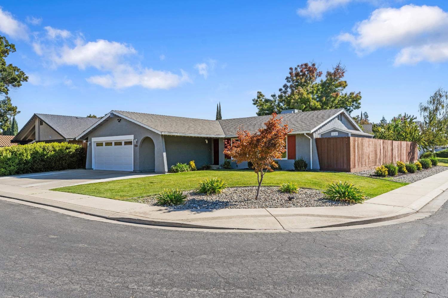 2612 Star Oak Court Modesto, CA 95355 - Photo 2 of 26 a front view of a house with a yard and garage