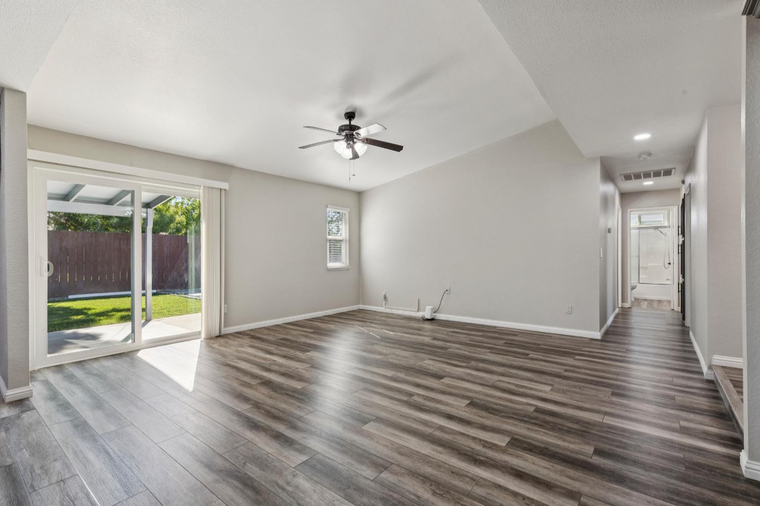 2612 Star Oak Court Modesto, CA 95355 - Photo 22 of 26 wooden floor in an empty room with a window