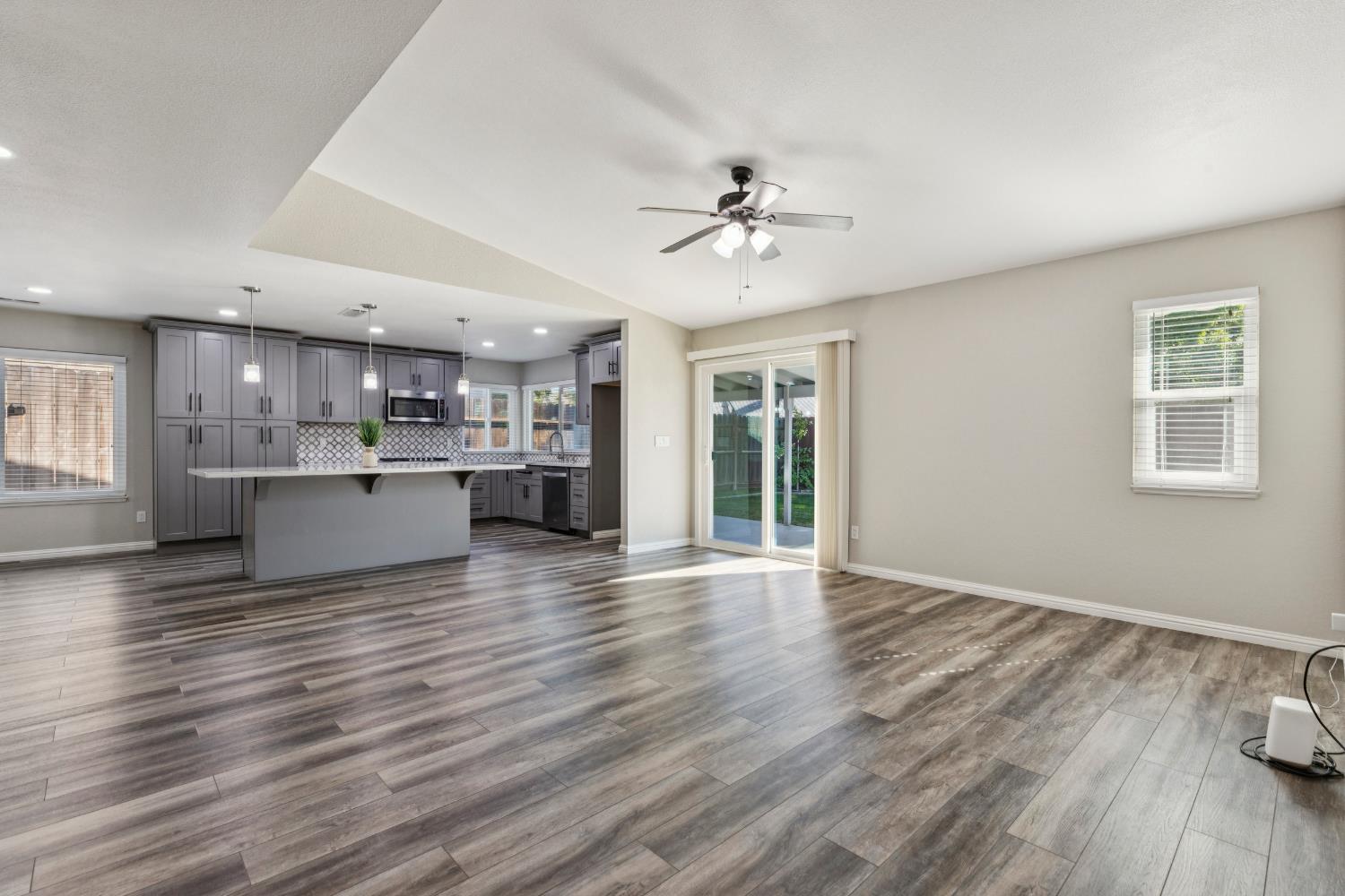 2612 Star Oak Court Modesto, CA 95355 - Photo 24 of 26 a view of kitchen and hall with wooden floor and a kitchen