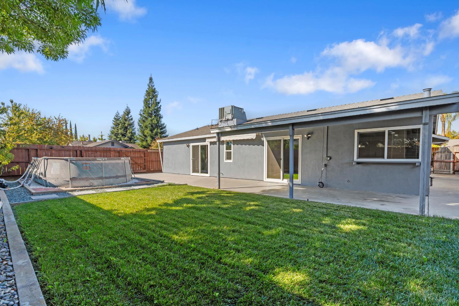 2612 Star Oak Court Modesto, CA 95355 - Photo 7 of 26 a view of a house with a yard and a porch