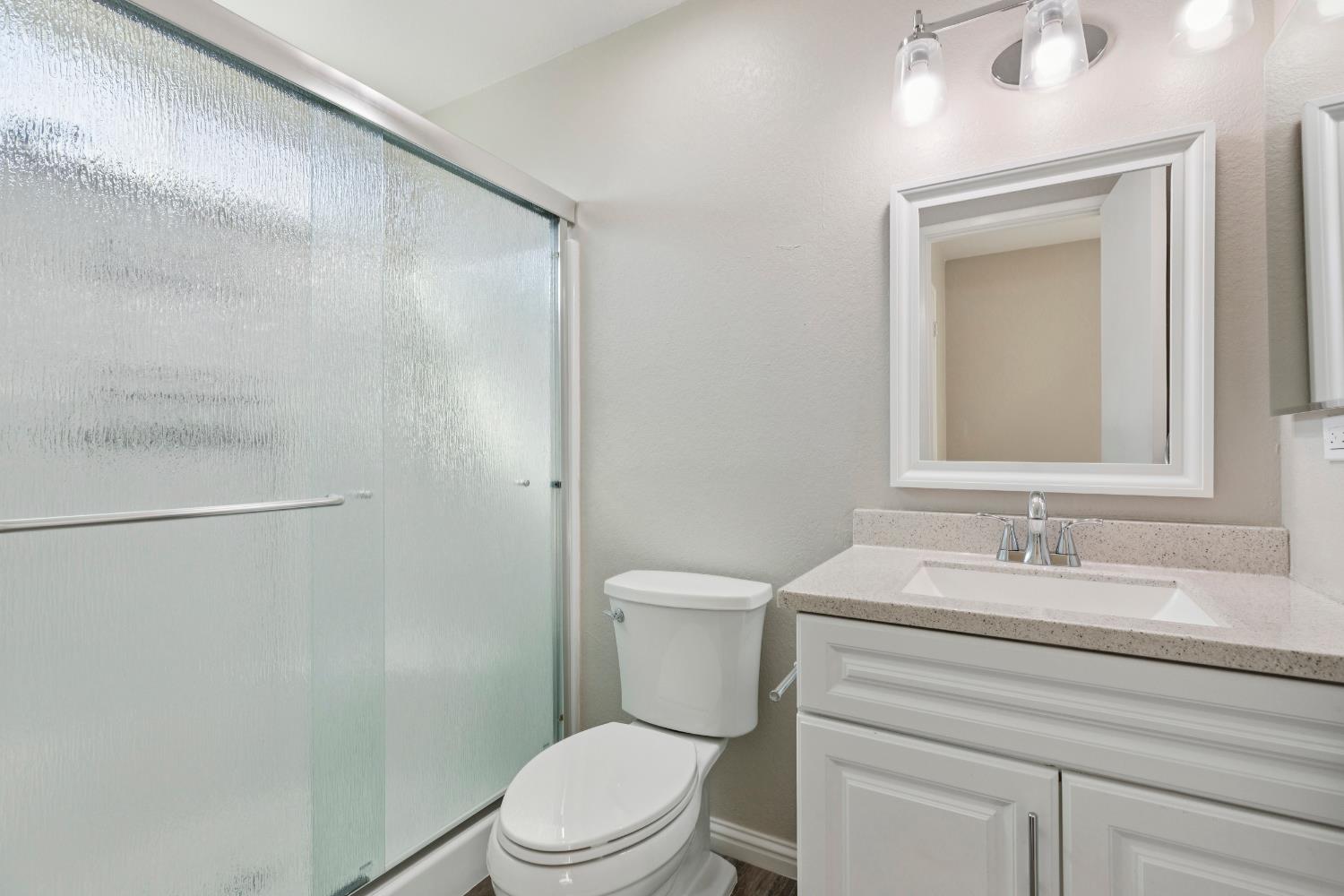 2612 Star Oak Court Modesto, CA 95355 - Photo 9 of 26 a bathroom with a sink a toilet and shower