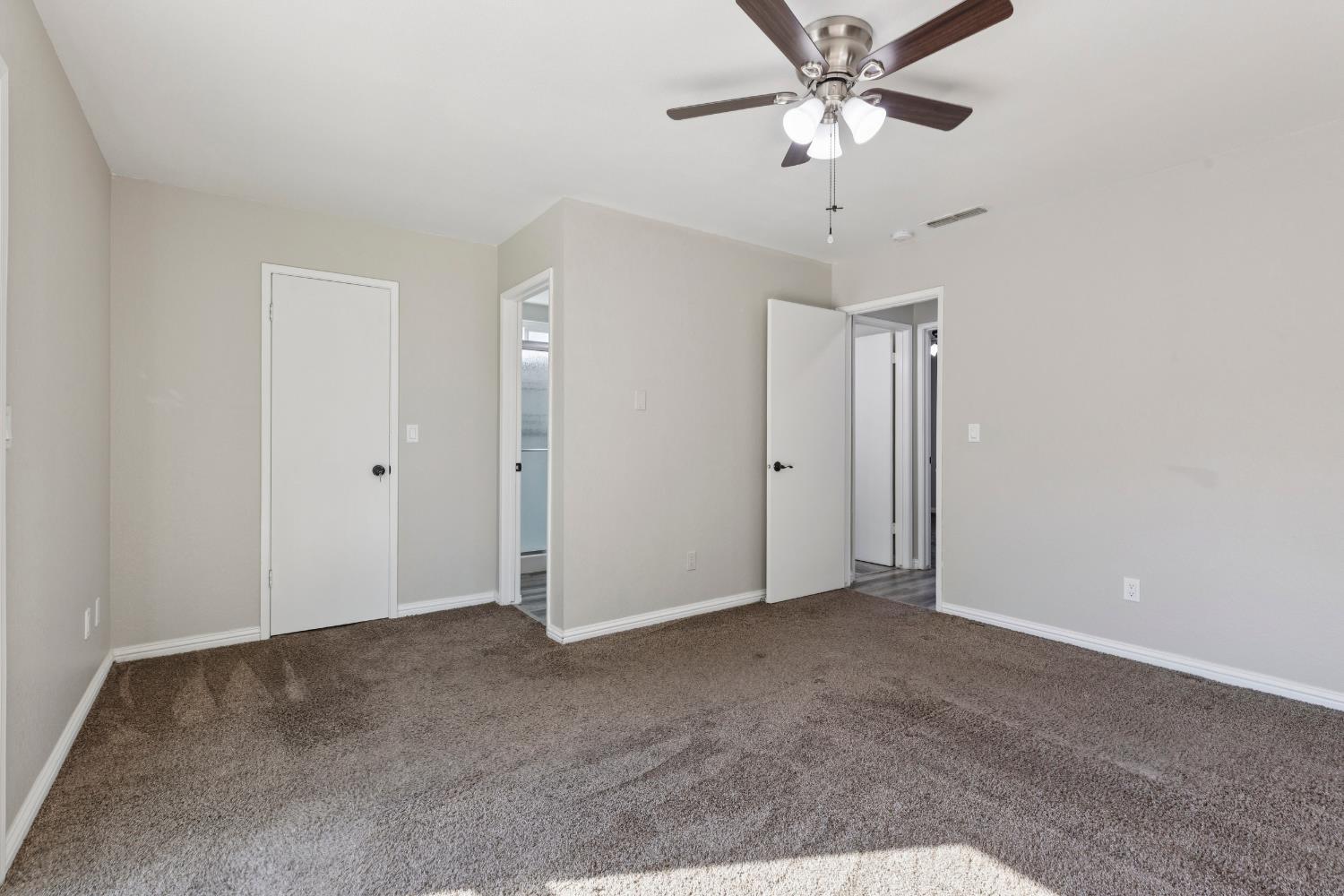 2612 Star Oak Court Modesto, CA 95355 - Photo 10 of 26 a view of a chandelier fan in a room