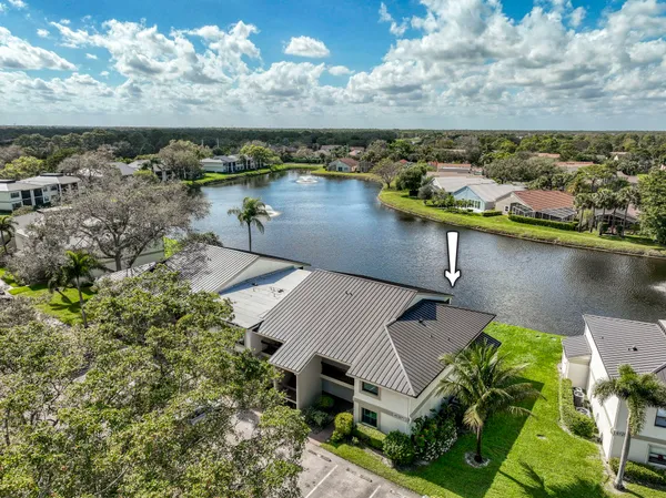 an aerial view of a house with a lake view