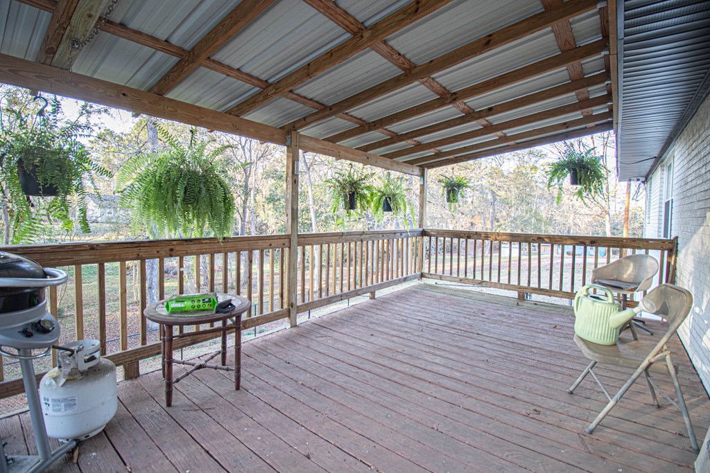 2811 16th Avenue Valley, AL 36854 - Photo 4 of 23 a porch with wooden floor in outdoor space