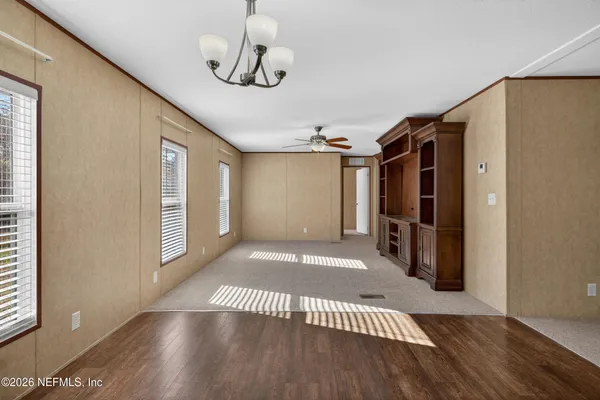 a view of a livingroom with wooden floor