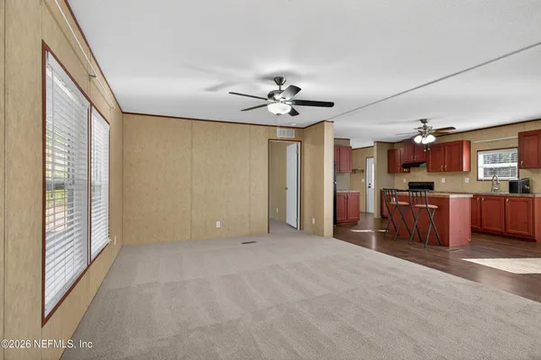 a view of a kitchen with a sink and a window