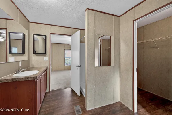 a bathroom with a sink and a mirror