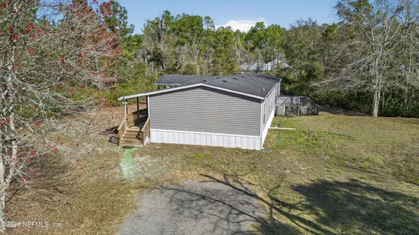 a house with trees in the background