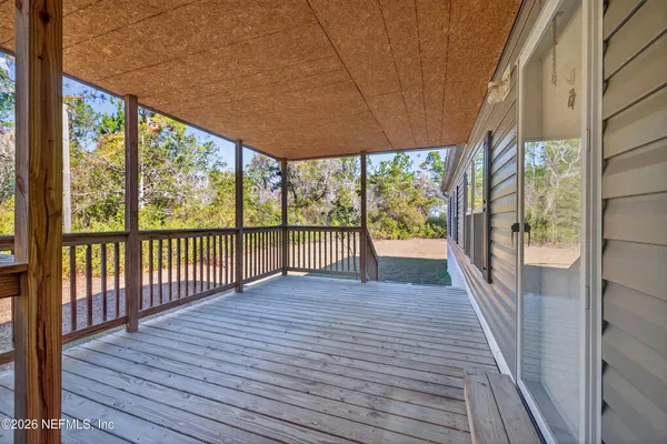 a view of porch with wooden floor and outdoor space