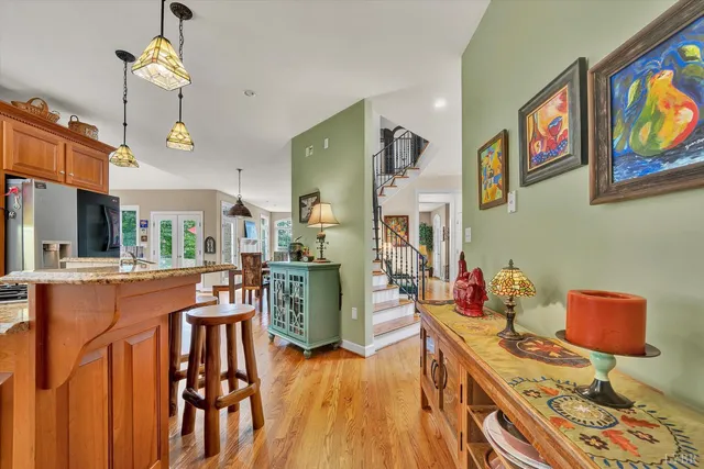 a kitchen with stainless steel appliances granite countertop a sink and cabinets