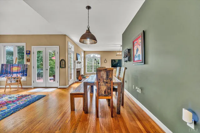 a very nice looking living room with a large window and a table