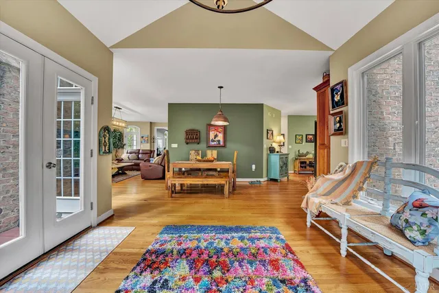 a living room with furniture flat screen tv and a fireplace