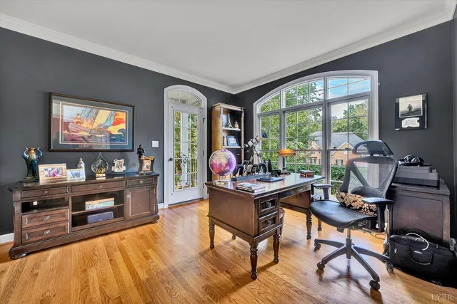 a bedroom with a bed window and dresser