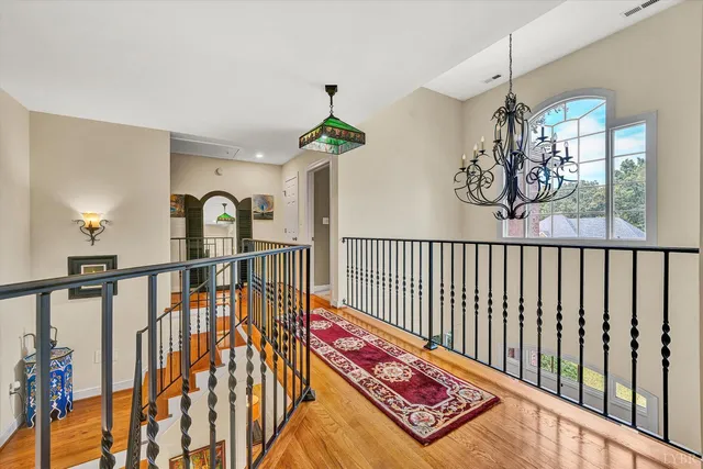 a bedroom with a bed and a night stand