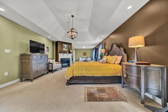 a living room with furniture a rug and a large window